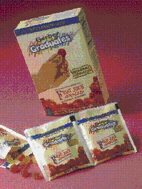 A door on an automated splicing machine is opened (above) to show where a film roll is marked for a roll splice. The splicing co