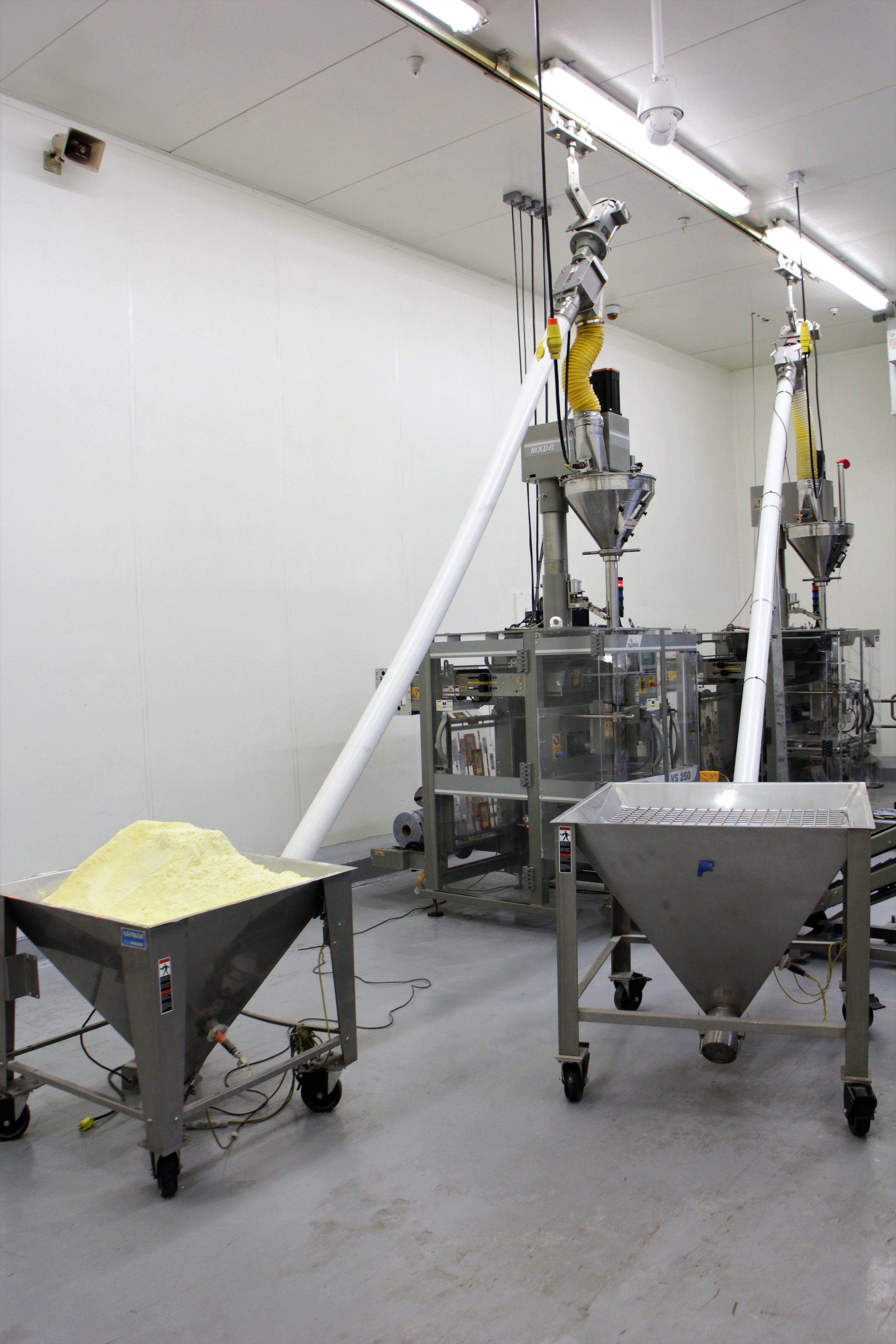 Guixens Food Group uses the Hapman Helix flexible screw conveyor to convey various dry and bulk products to its vertical form/fill/seal machine for packaging. Photo courtesy of Guixens Food Group.