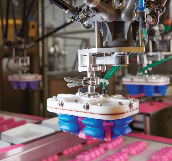 Peeps are loaded into trays by the JLS Talon robotic pick-and-place system, featuring ABB FlexPicker vision-guided robots and Soft Robotics gripper EOATs.