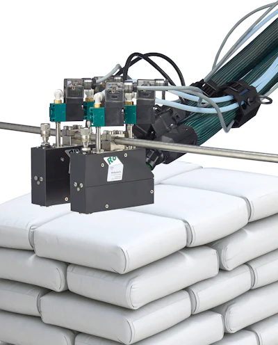 Robatech equipped the existing Concept melter with two of its next-generation AX spray heads.