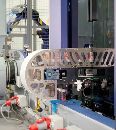 Freshly printed cans are unloaded from the Cyclone printing system open-end-up on a vacuum conveyor discharge that keeps each can fixed in one spot, leaving no opportunity for one can to touch another and possibly mar the uncured surface.