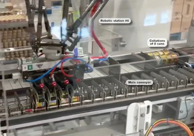 At this point, eight cans are collated in a flighted conveyor that leads to the station where all eight are pushed into an erected carton.