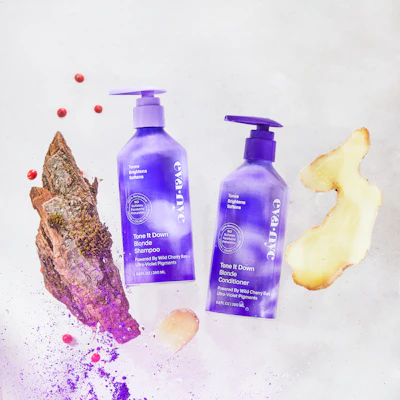 The new packaging includes several sizes of a custom-shaped aluminum bottle, decorated with vibrant, shiny pastel graphics in billowing, abstract patterns.