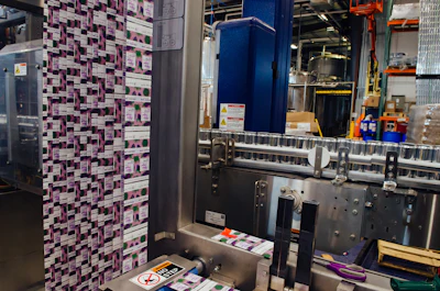 A sleeve labeler from Krones applies labels to brite cans.