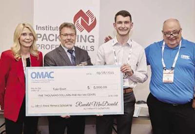 Stephanie Frisque, widow of John Kowal; Bryan Griffen, and OMAC Chairman Ron MacDonald of Nestle; present one of the first John A. Kowal Memorial Scholarships to Tyler Ebert.