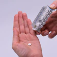 Applying pressure to the Packlock blister card and creating the rectangular prism is required to open up a space between the backing of the card, allowing the user to push a pill into the space and have the pill drop down.