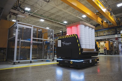 A pallet of pails are transported toward stretch wrapping operations. Mauser Packaging’s Oakville facility saw a 600% throughput improvement with the new AMRs over legacy AGVs, largely thanks to the OTTO’s fast, long-lasting charge.