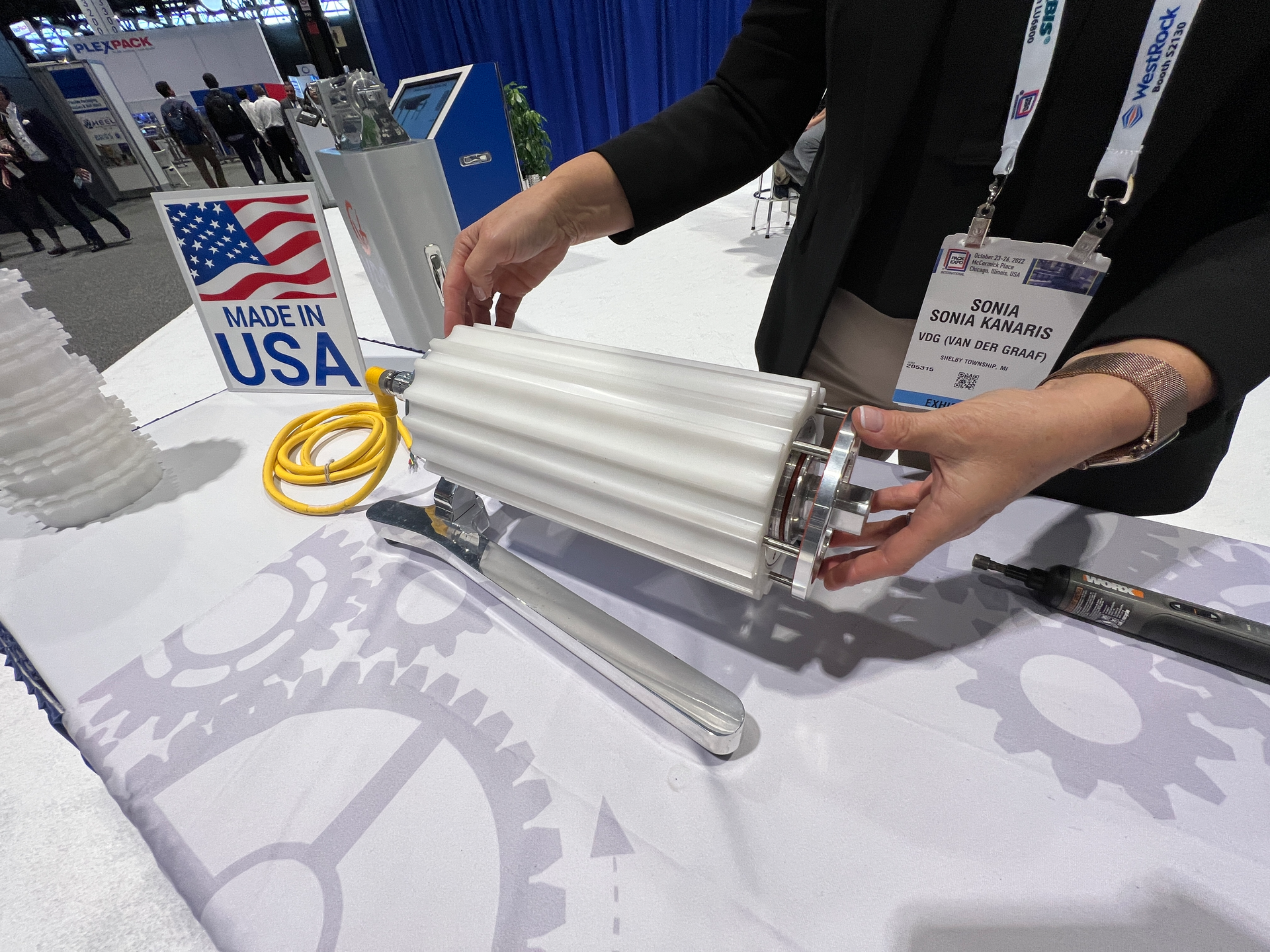 Sonia Kanaris demonstrates the easy removal of a profiled, nylon continuous sleeve on this drum motor at PACK EXPO International.