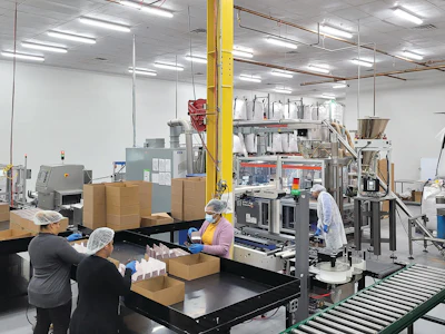 Workers at the JJM Packaging company on the production line at the Totowa, NJ facility.