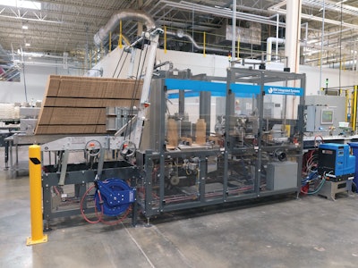 Cartons undergo a 90-deg turn and are oriented to travel wide-side first into case packaging operations. Once a 3 x 4 stacked format is collected, the block of cartons is pushed into postion in the wrap-around case packer. Adhesive is then applied ahead of palletizing.