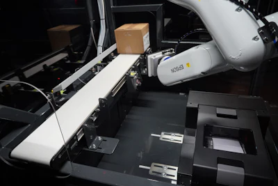 Custom self-contained labeling cell with an Epson VT6L All-in-One 6-Axis Robot and Epson ColorWorks CW-C6000P Color Inkjet Label Printer and custom label track, toolhead, and conveyor.
