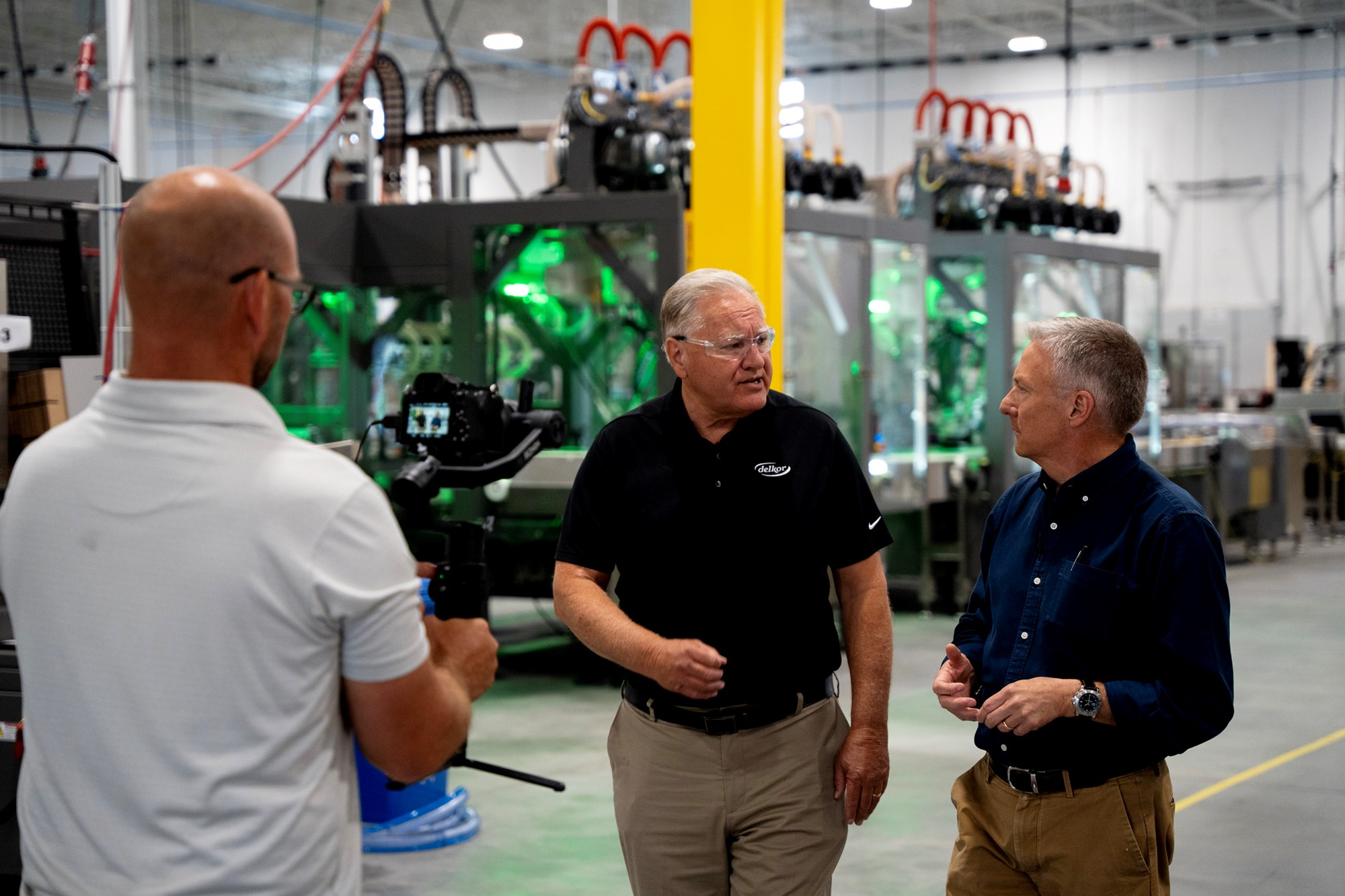 Tom Costello (right), Economics Reporter for NBC News, interviewed Dale Andersen (center), president and CEO of Delkor Systems.