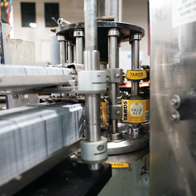 Bottles are cold-glue labeled around the body and neck on a Krones Solomatic.