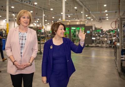 PMMI Chairperson Patty Andersen (left) tours Delkor's facility with Senator Amy Klobuchar.