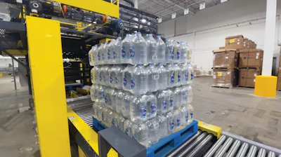 Unlike HDPE jugs, the BottleOne PET format’s top-load strength allows for stacking without corrugated. Shown here in four layers, the company is currently experimenting with adding a fifth layer.