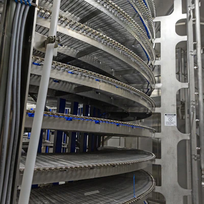 While spiral freezing units are mostly automated, food producers are experiencing labor challenges upstream and downstream with operations. Image courtesy of JBT Corp