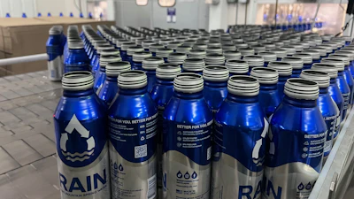 Depalletized bottles are single-filed and lowerated before air rinsing and filling.