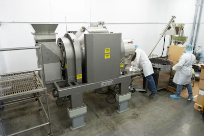 The Rotary Batch Mixer discharges to a screw conveyer, which transfers mixed powder products to an auger filling machine.
