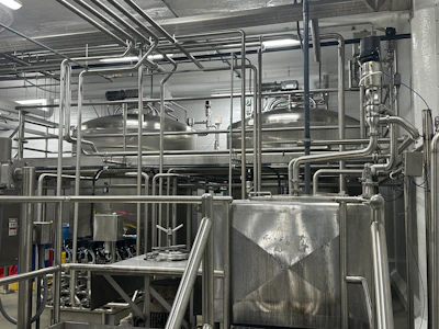 Two large mix tanks connect to a liquefier as part of the base mix production process for TCCA's ice cream.
