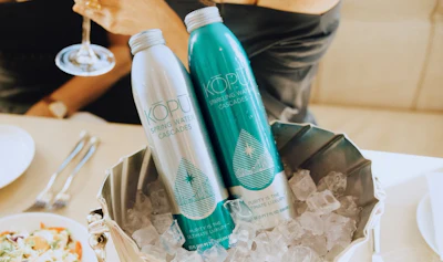 Kopu&rsquo;s premium aluminum bottles bring elegance and sustainability to the table, offering a refined water service that aligns with luxury hospitality values.