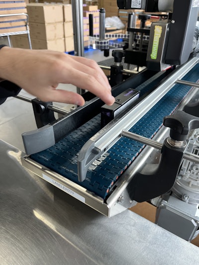 Fernway’s Paxiom dual-head labeler applies regulatory and branding labels to opposite sides of premium cartons at up to 40 per minute.