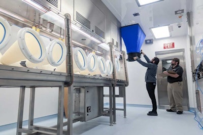 Hazardous BSL_3 GMP facility with containment isolator.