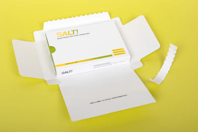 A simple paperboard mailer wraps around the pack, ensuring that the products are delivered in one piece and the pack inside can be kept by the recipient and used to dispense the sachets.