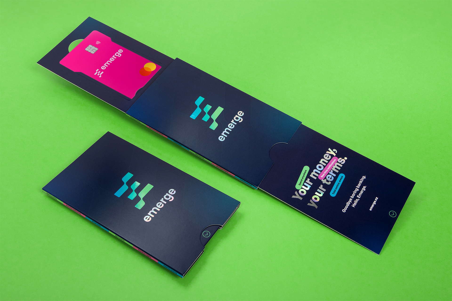 Burgopak designed a dual-slide mailer for fintech startup Emerge&rsquo;s bank card, using 300 GSM artboard with holographic foil and spot UV to create an interactive unboxing experience.