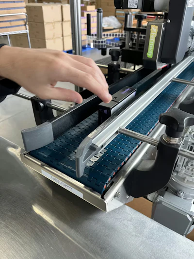 Fernway&rsquo;s Paxiom dual-head labeler applies regulatory and branding labels to opposite sides of premium cartons at up to 40 per minute.