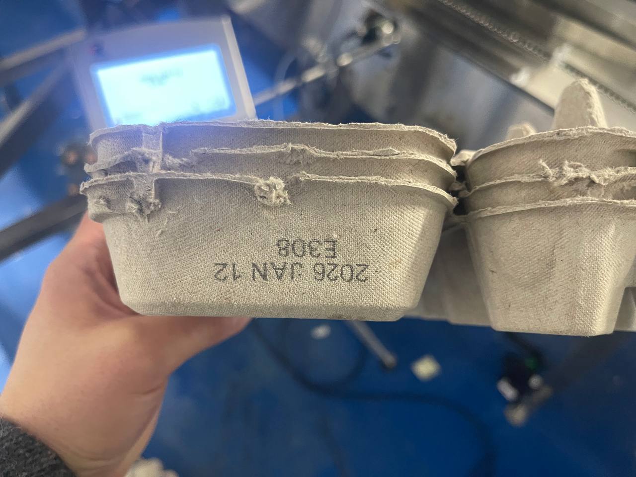 The side of each carton gets a clean, readable lot and date code.