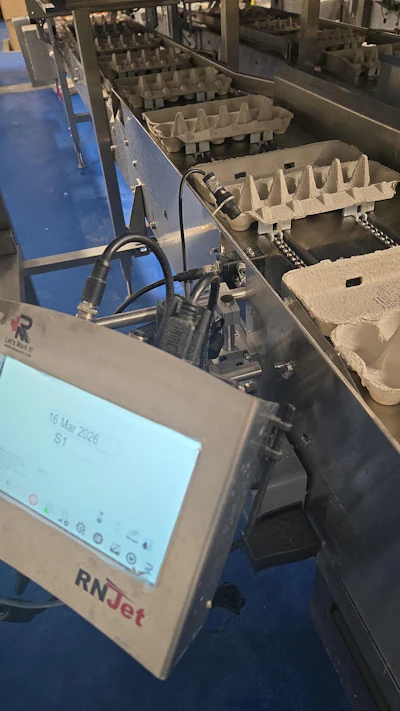 Shown here is one of eight small-character ink-jet printers operating on the highly automated egg cartoning line at Nature Plus.