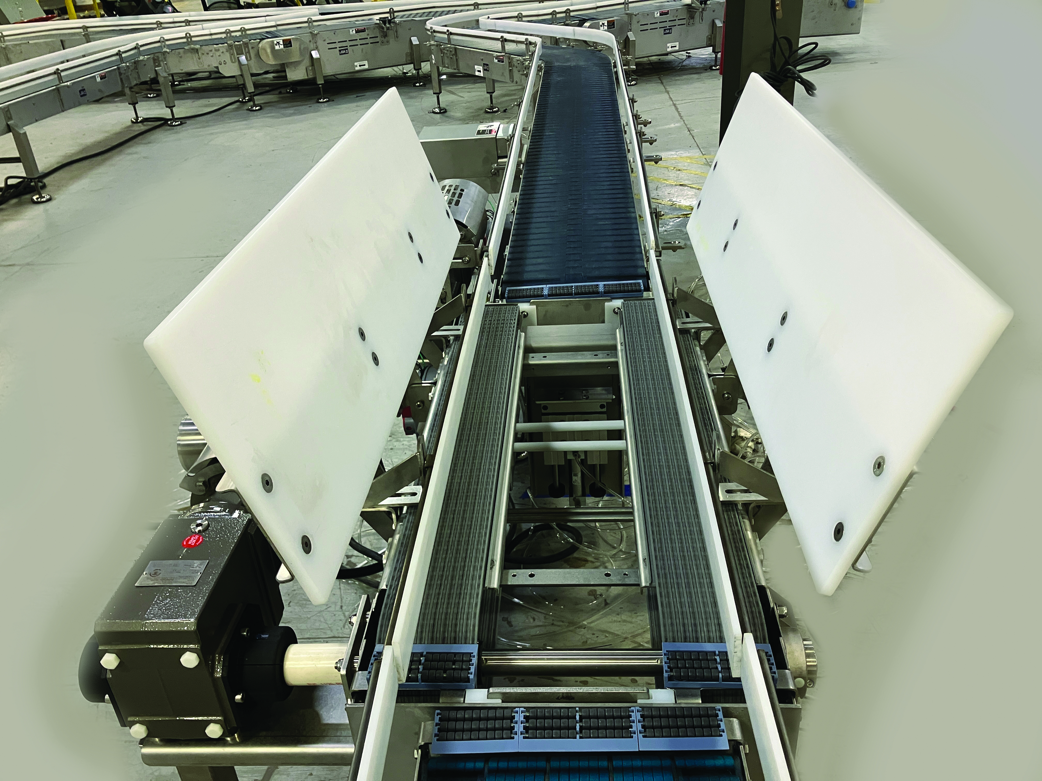 Multi-Conveyor's traffic cop assists cast divert merge.